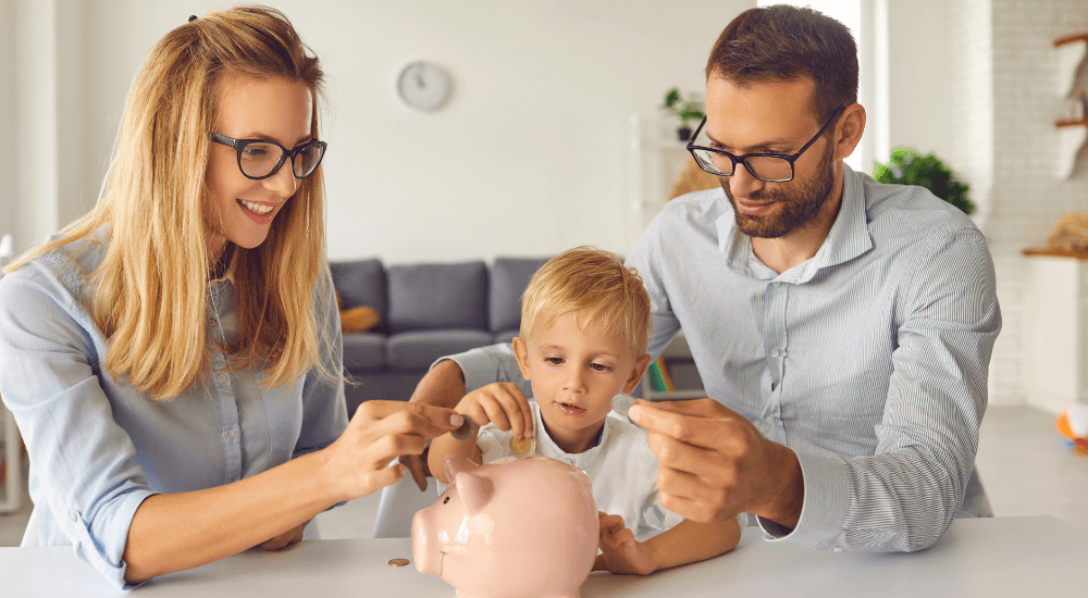parents with their child and a piggy bank