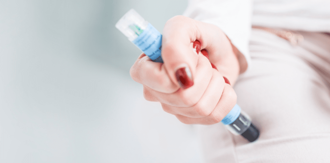 women using epi-pen injector