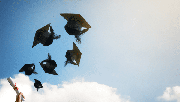 college graduation caps in the air